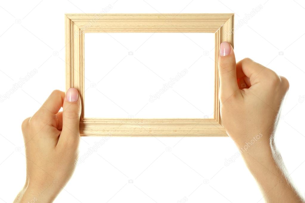 Female hands with wooden frame