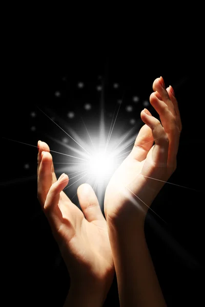 Light in the human hands in the dark — Stock Photo, Image