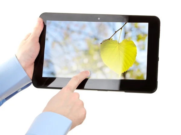 Manos sosteniendo la tableta de la pantalla táctil con la foto aislada en blanco — Foto de Stock