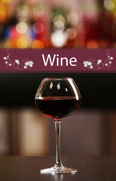 Glass of red wine in bar on blurred background — Stock Photo, Image