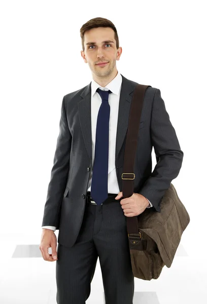 Muž, který držel kufr na světlé pozadí — Stock fotografie