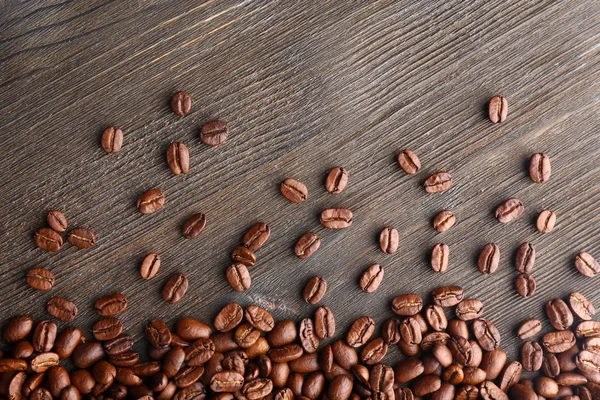 Coffee beans on wooden background — Stock Photo, Image