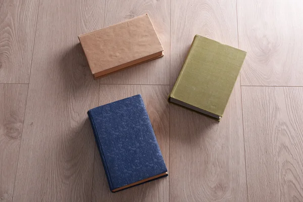 Old books on wooden background — Stock Photo, Image