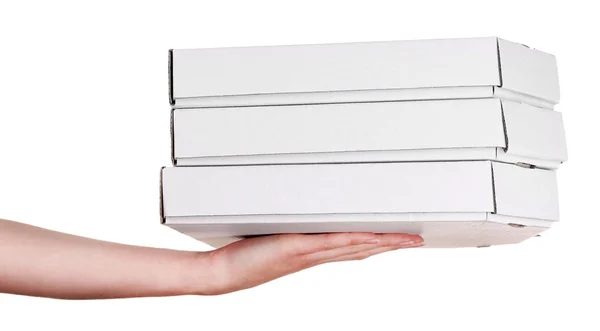 Mão segurando caixas de pizza isoladas em branco — Fotografia de Stock