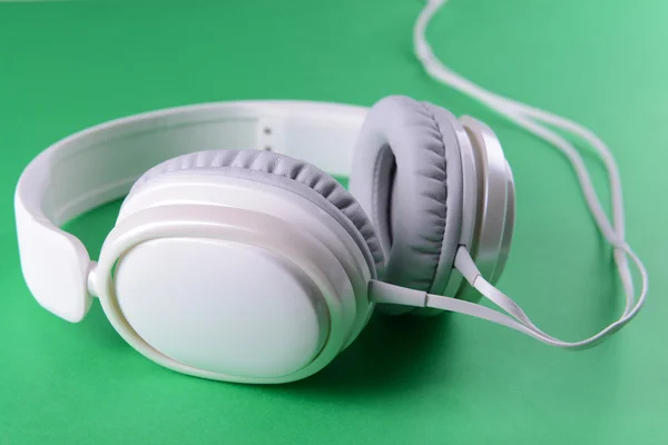 Headphones on green background — Stock Photo, Image