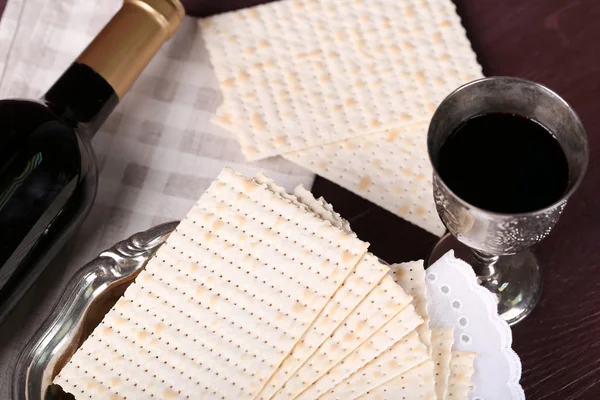 Matzo for Passover with metal tray and wine on table close up — Stock Photo, Image