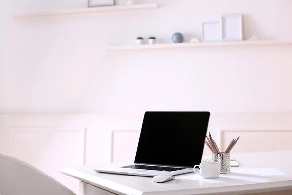 Workplace with laptop in room — Stock Photo, Image
