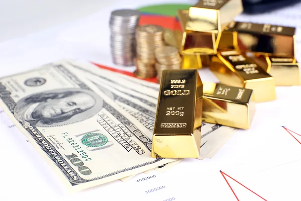 Gold bullion with money on table close up — Stock Photo, Image