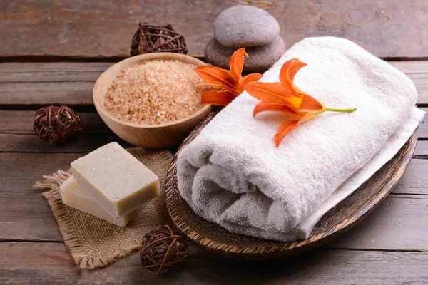 Beautiful spa composition with flowers on wooden table close up — Stock Photo, Image