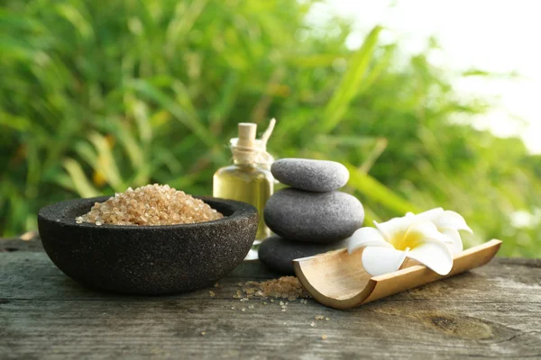 Spa still life on wooden surface  over green reeds on river — Stock Photo, Image