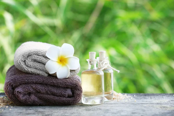 Spa still life on wooden table on river — Stock Photo, Image