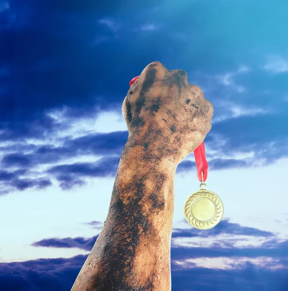 Golden medal in hand — Stock Photo, Image