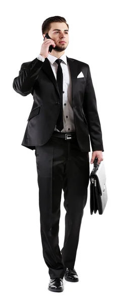 Elegancki mężczyzna w garniturze z telefonu komórkowego i teczki na białym tle — Zdjęcie stockowe