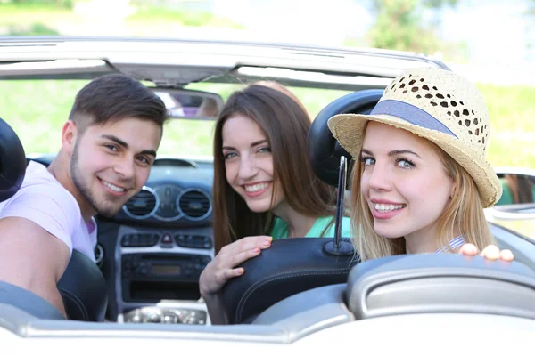 Three friends in cabriolet, outdoors — Stock Photo, Image