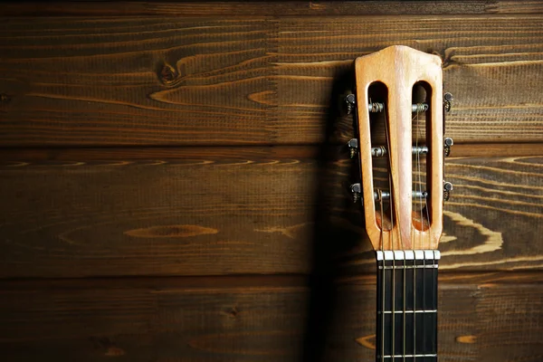 Classical guitar on wooden background — Stock Photo, Image