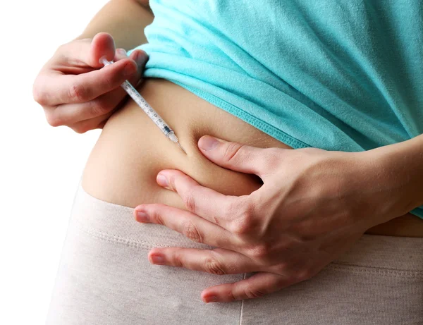 Woman doing shot in stomach close up — Stock Photo, Image