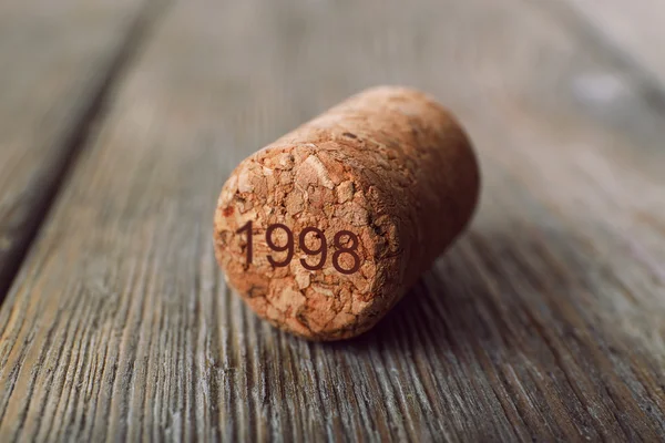 Wine cork on wooden background — Stock Photo, Image