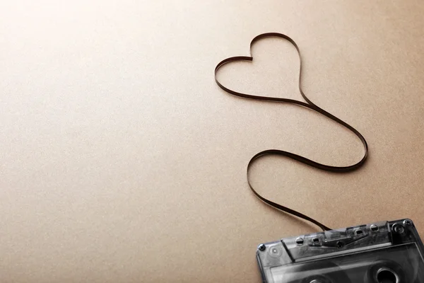 Cassette with magnetic tape in shape of heart — Stock Photo, Image