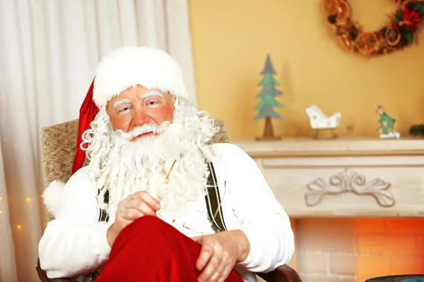 Santa Claus sitting in comfortable chair — Stock Photo, Image