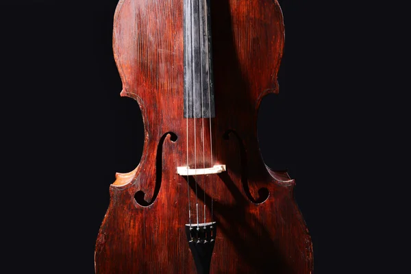 Vintage cello on dark background — Stock Photo, Image