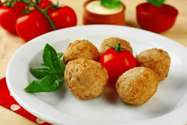Meat balls on plate, on wooden table background — Stock Photo, Image