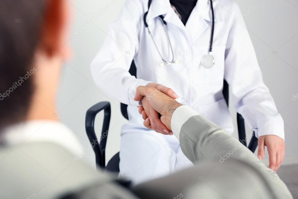 Doctor receiving patient