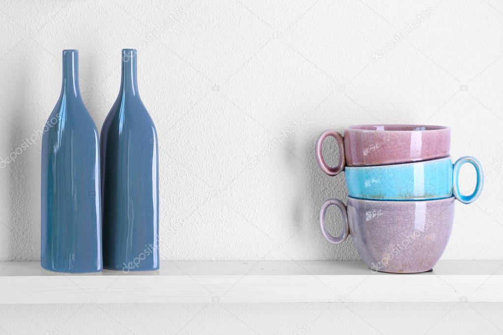 Decorative vases on shelf — Stock Photo © belchonock 78349050