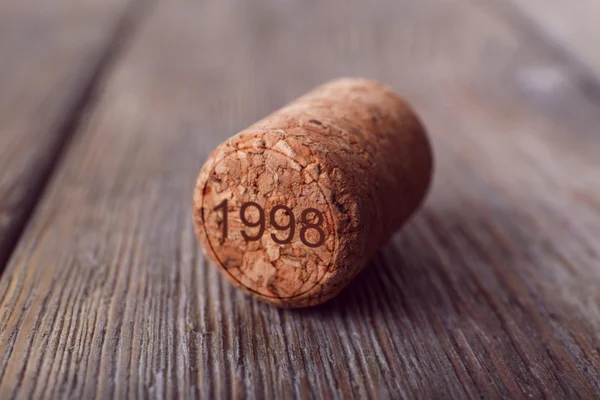 Wine cork on wooden background — Stock Photo, Image