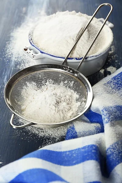 Sifting flour through sieve — Stock Photo, Image