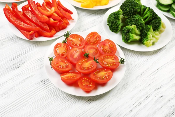 Different products on saucers — Stock Photo, Image