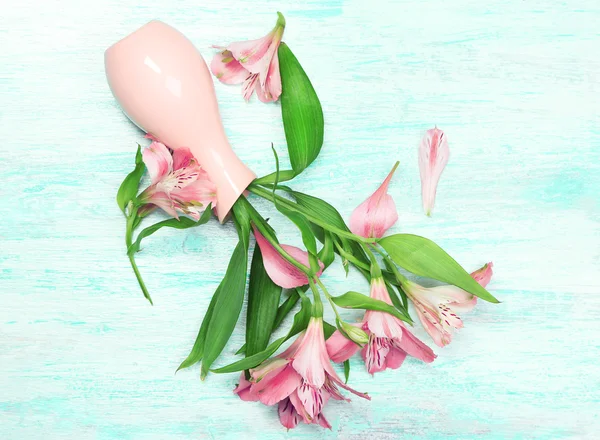 Beautiful alstroemeria in vase on wooden background — Stock Photo, Image