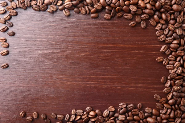 Coffee beans on wooden background — Stock Photo, Image