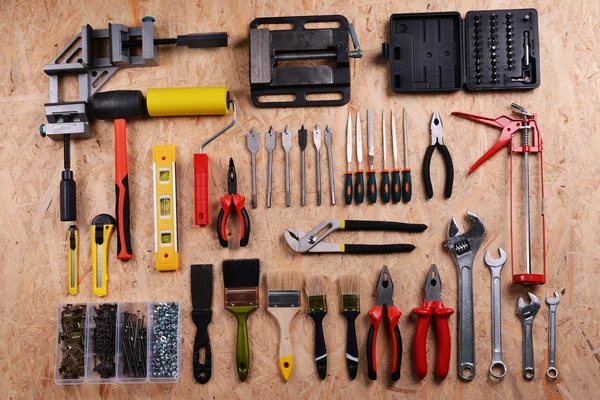 Conjunto de herramientas en madera contrachapada, vista superior —  Fotos de Stock