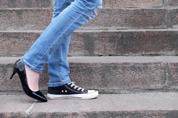 Female feet in different shoes — Stock Photo, Image