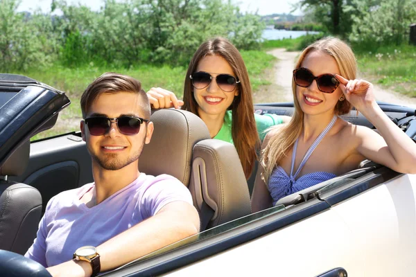 Three friends in cabriolet, outdoors — Stock Photo, Image
