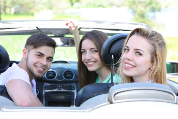 Three friends in cabriolet, outdoors — Stock Photo, Image