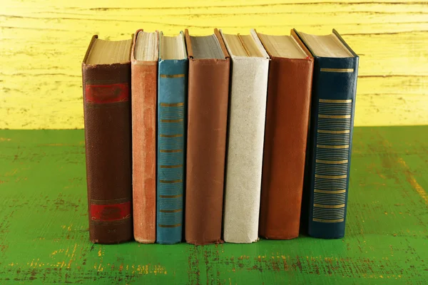 Stack of books on wooden background — Stock Photo, Image