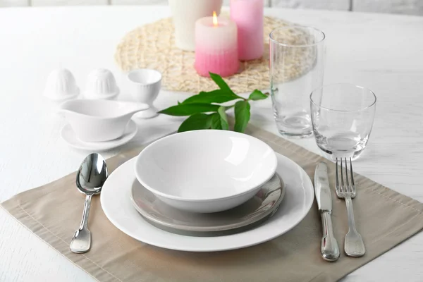 Beautiful table setting with candles — Stock Photo, Image