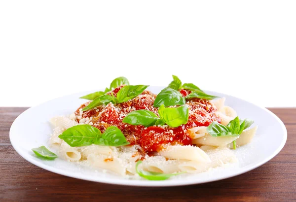 Pasta with tomato sauce and basil on light background — Stock Photo, Image