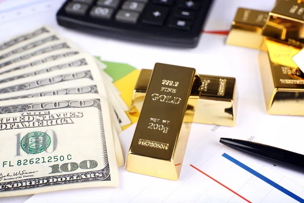 Gold bullion with money on table close up — Stock Photo, Image