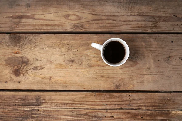 Cup of coffee on wooden background — Stock Photo, Image