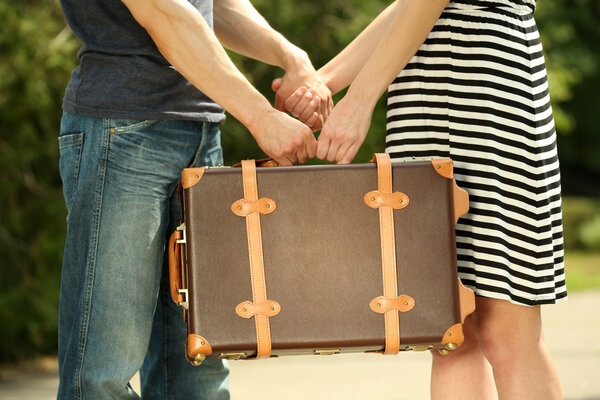 couple with vintage suitcase