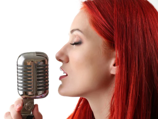 Woman singing with microphone — Stock Photo, Image