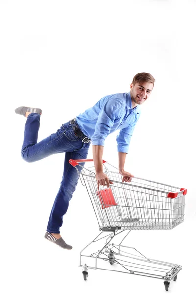 Jovem com carrinho de compras vazio, isolado em branco — Fotografia de Stock