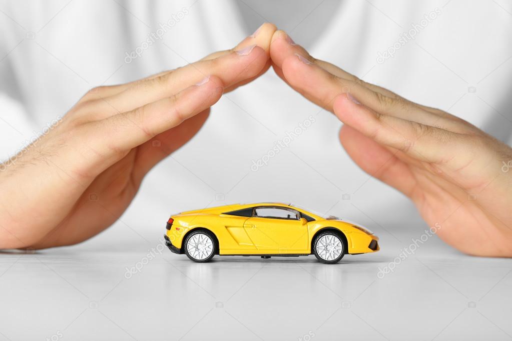 Male hands and car