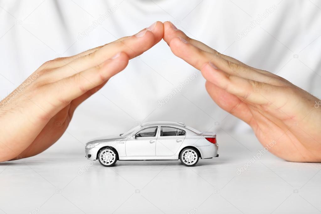 Male hands and car