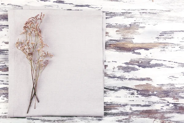 Beautiful dry flowers on napkin — Stock Photo, Image