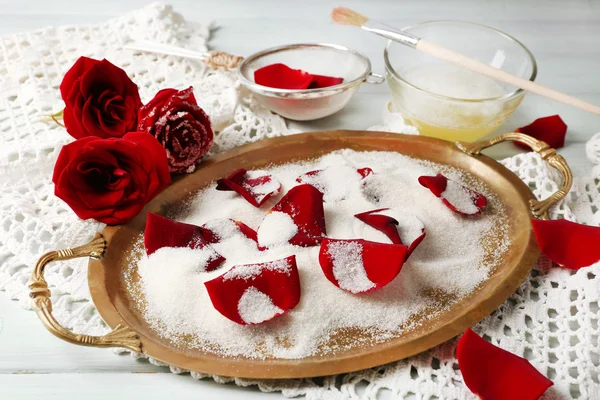 Making candied rose flower petals with egg whites and sugar, on wooden background — Stock Photo, Image