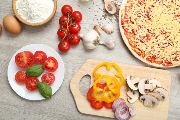 Food ingredients for pizza on table close up — Stock Photo, Image