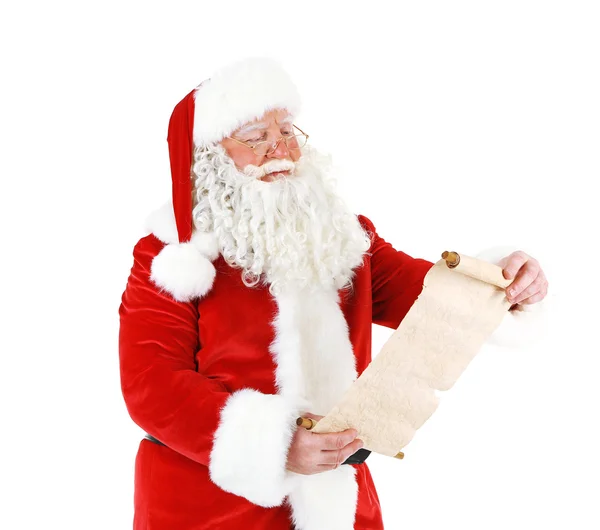 Santa Claus holding wish list, isolated on white background — Stock Photo, Image